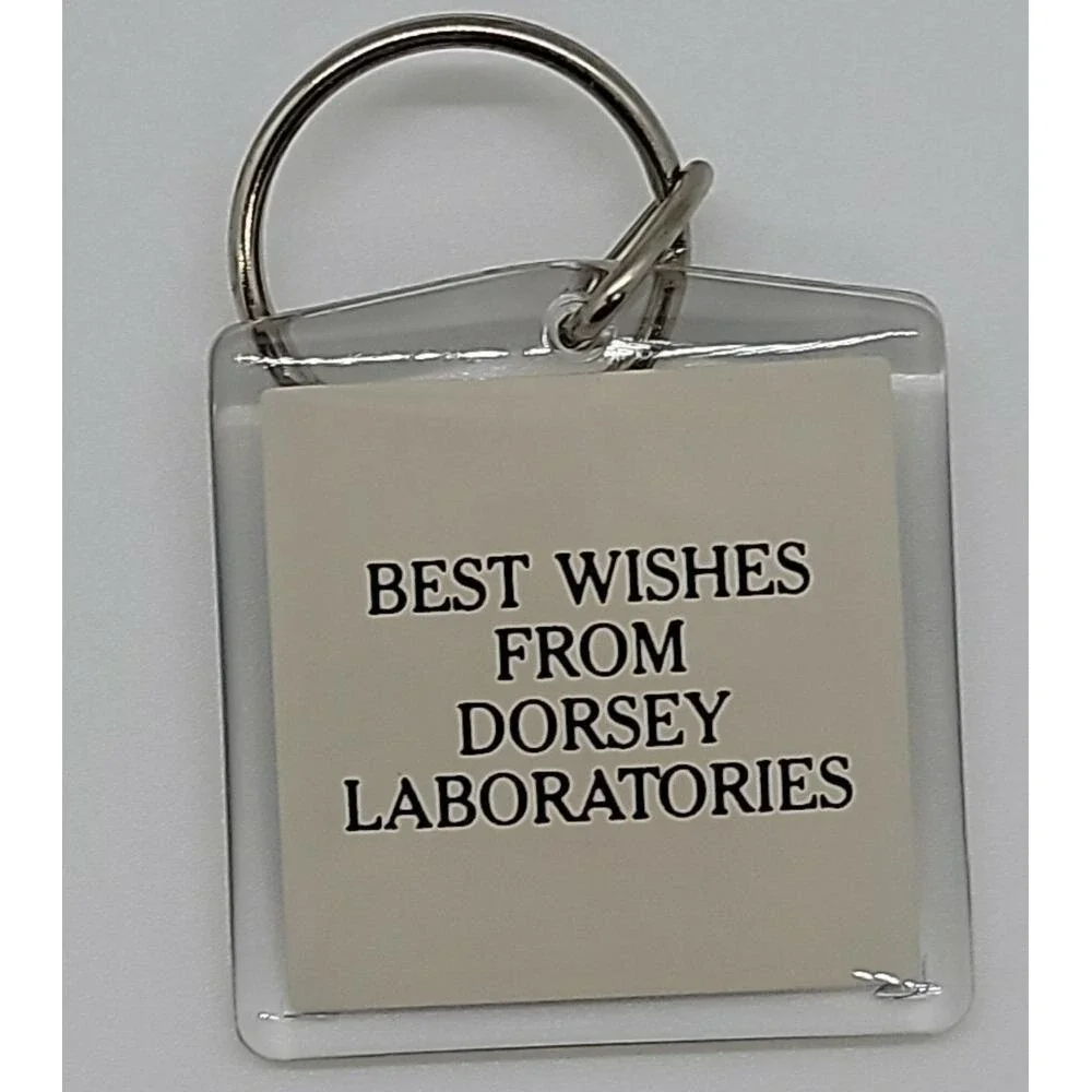Best Wishes from Dorsey Laboratories ad advertising grasshopper in cage keychain